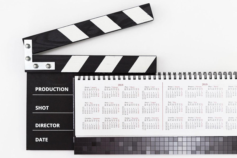 Film clapper board with schedule