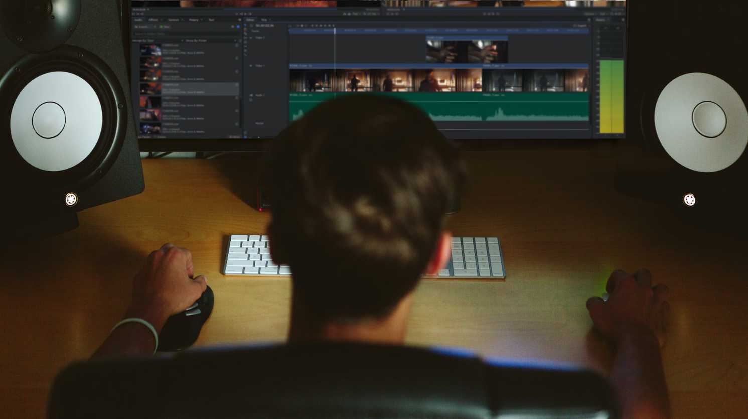 VFX artist working at a desk on HitFilm Pro VFX software - what does a VFX artist do?